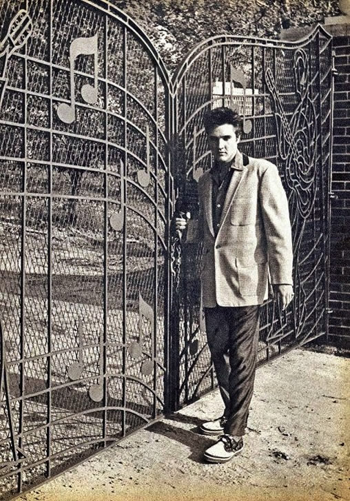 Elvis Presley poses at the new Music Gates for press photo, April 22, 1957. 